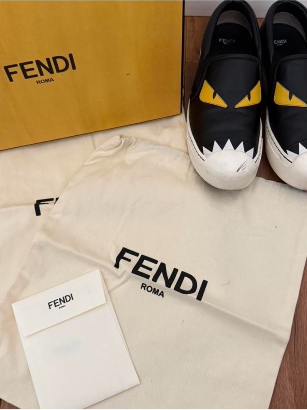 Fendi Monster Black Leather Slip-On Sneakers with Yellow Logo